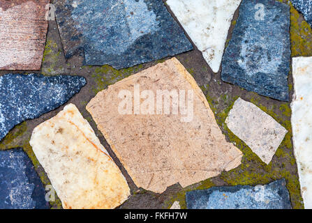 Frammento di grigio di un muro di pietra come sfondo Foto Stock