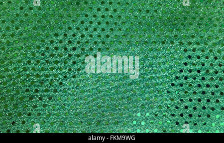 Close up del grassetto verde in tessuto lucido con paillettes. Foto Stock