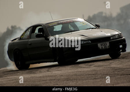 Corby, Northamptonshire, Regno Unito. Xii Mar, 2016. Nissan auto di deriva durante il Drift Matsuri a Rockingham Motor Speedway il 12 marzo 2016 in Corby, Northamptonshire, Regno Unito. Credito: Gergo Toth/Alamy Live News Foto Stock