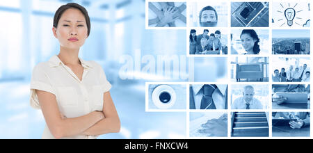 Immagine composita di colleghi di lavoro con le braccia incrociate in office Foto Stock