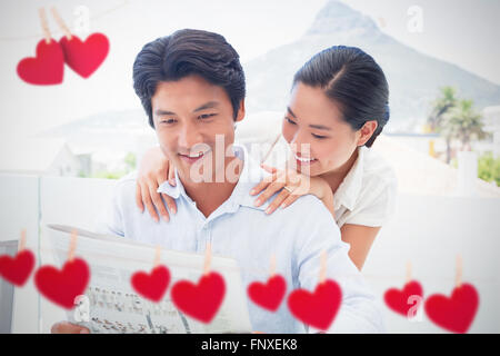 Immagine composita di cuori appesi su una linea