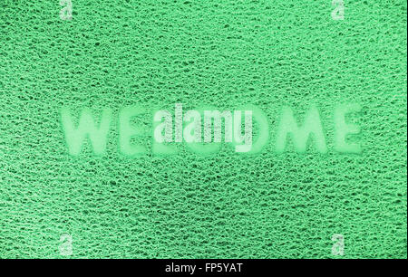 Benvenuti in plastica porta rossa capet texture dello sfondo. Foto Stock