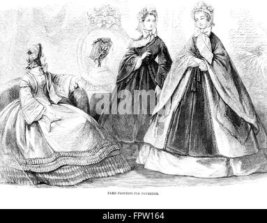 1860s MODE DEL GIORNO ILLUSTRAZIONE 1861 3 donne modelli abiti lunghi crinolina gonna cerchio CAPE HAT ANTEBELLUM ABBIGLIAMENTO DI STILE Foto Stock