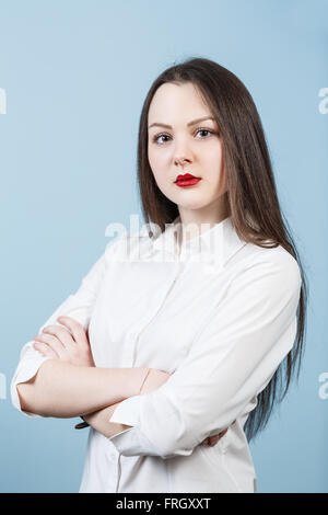 Giovane donna con due mani incrociate Foto Stock