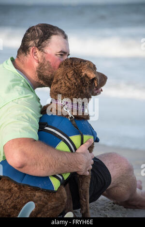 Fernandina Beach, Stati Uniti d'America. Il 24 marzo 2016. Un giorno prima del grande evento cani provenienti da tutto il paese di partecipare a un cane clinica surf guidato da Adam scatta Steinberg alla spiaggia principale su Amelia Island, Stati Uniti d'America. Credito: David giorno/Alamy Live News. Foto Stock