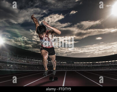 Atleta giapponese in esecuzione su via Foto Stock