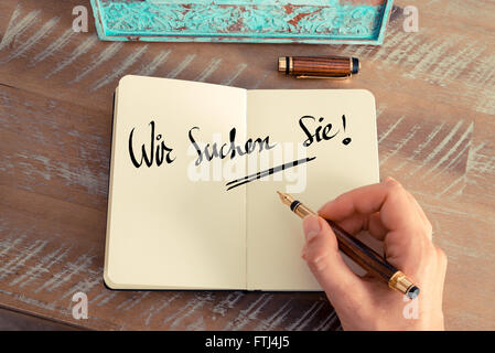 Il testo scritto a mano in tedesco "Wir suchen Sie' - traduzione : Cercando Te come business Concetto di immagine Foto Stock