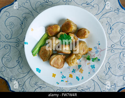 Timbro e andare - crocchette di pesce fatta con sale pesce in cucina Giamaicana Foto Stock