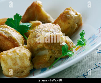 Timbro e andare - crocchette di pesce fatta con sale pesce in cucina Giamaicana Foto Stock