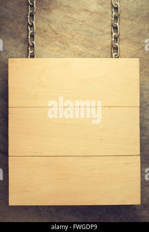 Cartello appeso al muro sfondo Foto Stock