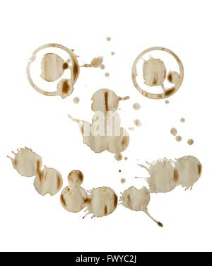 Molte macchie di caffè come forma della faccia su sfondo bianco. Foto Stock