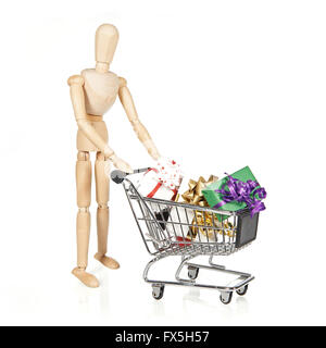 Carattere di legno con carrello e regali di Natale isolato su bianco Foto Stock