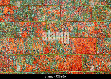Pavimentazione in pietra texture. Di granito rosso pavimentazione in ciottoli sfondo. Abstract di sfondo lucido sentiero acciottolato Foto Stock