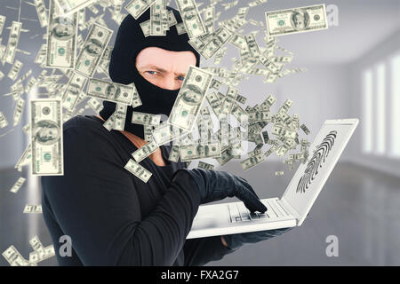 Immagine composita di hacker utilizzando laptop per rubare l'identità Foto Stock
