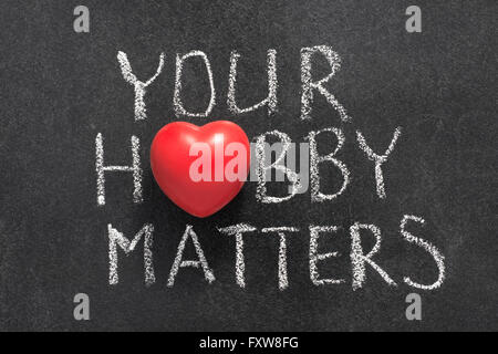 Il tuo hobby conta una frase scritta a mano sulla lavagna con il simbolo del cuore di invece di o Foto Stock