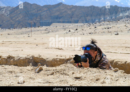 Mimetizzati fotografo Foto Stock