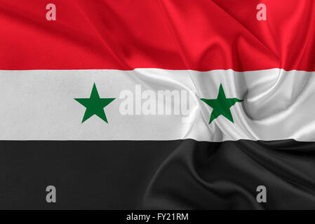 Bandiera della Siria sventolare nel vento. Foto Stock