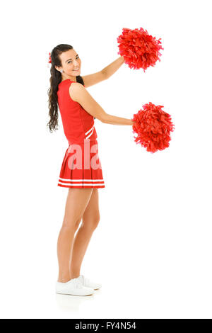 Femmina carino come un American sports cheerleader, in bianco e rosso vestito. Isolato su sfondo bianco. Foto Stock