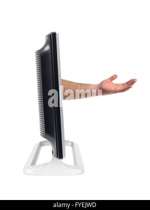 Un TV LCD monitor con una mano sporgenti in fuori isolata contro uno sfondo bianco Foto Stock