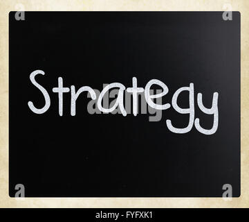 Manoscritte di strategia con il bianco gesso su una lavagna Foto Stock