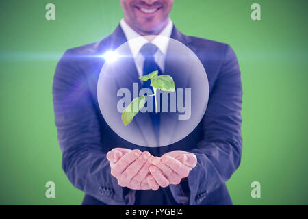 Immagine composita di imprenditore sorridente presentando con le mani Foto Stock