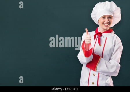 Immagine composita di pretty chef mostra pollice in alto Foto Stock
