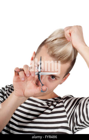 Ritratto di uomo bello con le forbici Foto Stock