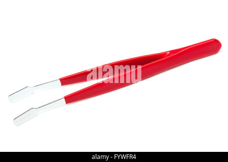 Pinzette a molla su sfondo bianco Foto Stock