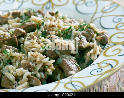 Bahsh Uzbek pilaf - Verde plovwith carne e fegato Foto Stock