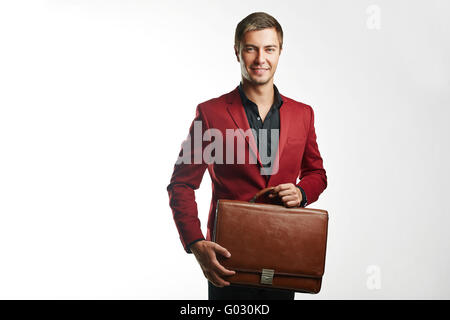Giovane uomo d affari in possesso di una valigia Foto Stock
