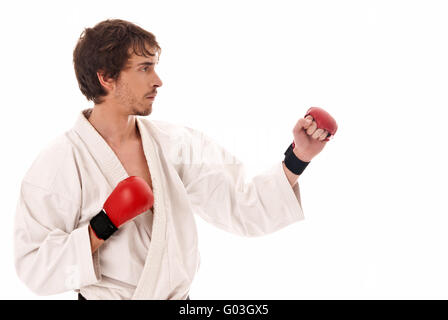 Il Karate combattente maschio giovane isolato su sfondo bianco Foto Stock