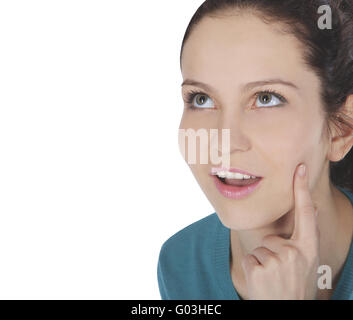 Immagine luminosa di sorpreso giovane donna faccia con dito in bocca Foto Stock