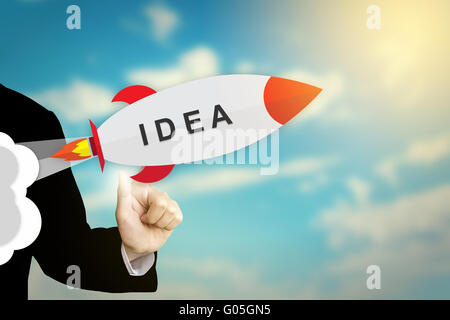 Mano di business facendo clic su idea design piatto rocket Foto Stock