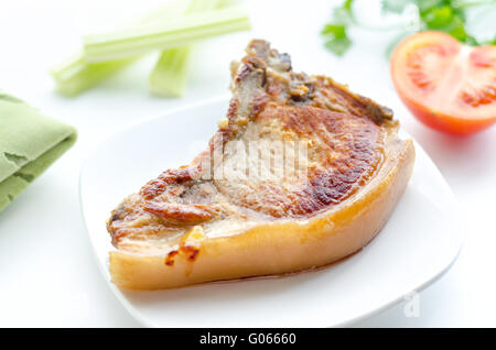 Arrosto di maiale in una ciotola, mattina e bokeh di fondo Foto Stock