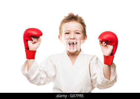 Sorridente campione del karate bambino ragazzo gesticolando per vi Foto Stock