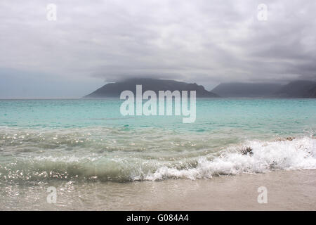 Spiaggia di Kommetjie con un imminente tempesta in background Foto Stock