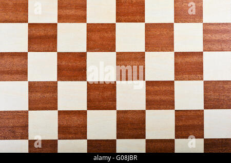 Sullo sfondo di una scacchiera Foto Stock