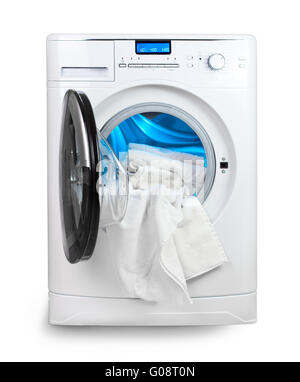 La macchina di lavaggio con una porta aperta e biancheria da letto Foto Stock