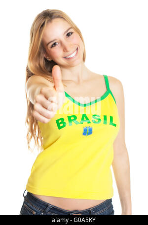 Sport brasiliano fan che mostra il pollice in alto Foto Stock