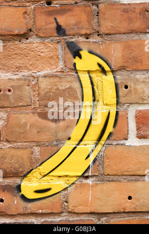 Banana-graffiti su un muro di mattoni, backround Foto Stock
