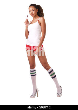 Donna in pantaloncini e maglietta con lecca-lecca Foto Stock