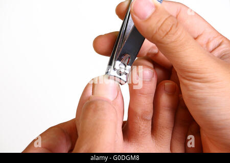 Punta di taglio delle unghie con un cutter isolato su bianco Foto Stock