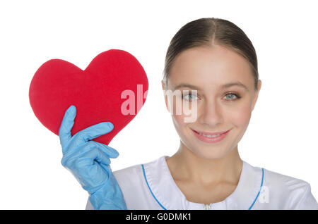 Medico donna in guanti mostra un simbolo del cuore Foto Stock