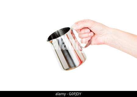 In acciaio inox caldaia di latte caraffa in mano isolato su bianco Foto Stock