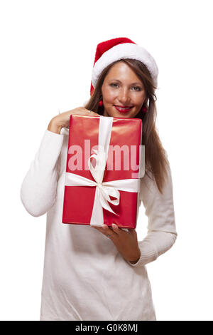 Pretty Woman in un cappello da Babbo Natale con un grande dono Foto Stock