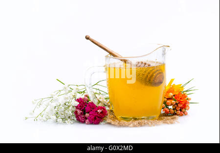Il miele. Mano con la cucchiaia miele di prelievo da un vasetto di miele Foto Stock