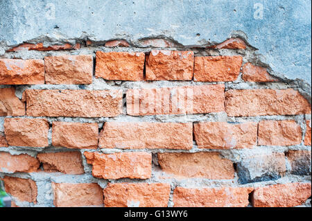 Tono Vintage incrinato il vecchio muro di mattoni per lo sfondo Foto Stock