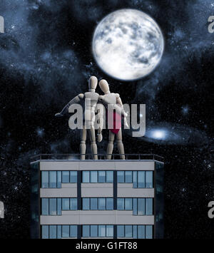 Coppia di figure in legno sul tetto Foto Stock