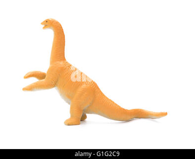 Vista laterale arancione diplodocus toy su sfondo bianco Foto Stock