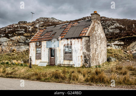 Un stagno abbandonati shack Foto Stock